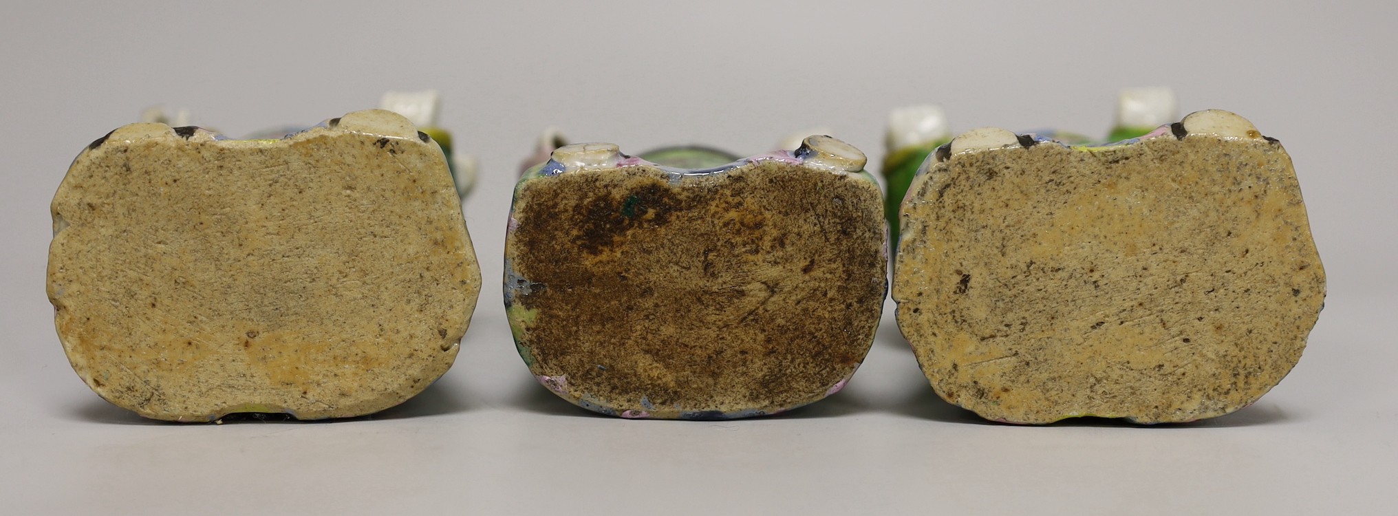 A near pair of Chinese polychrome-decorated figural incense burners and another similar incense burner, Jiaqing period (1796-1820), tallest 20.5cm